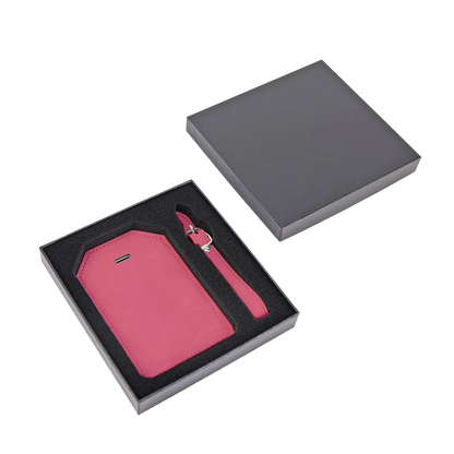 Close-up of personalized pink vegan leather luggage tag with custom engraving