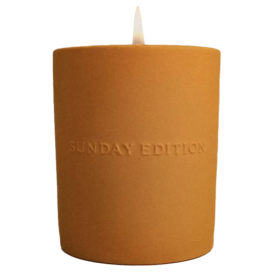 Sunday Edition Dawn candle with custom logo label on a white frosted jar