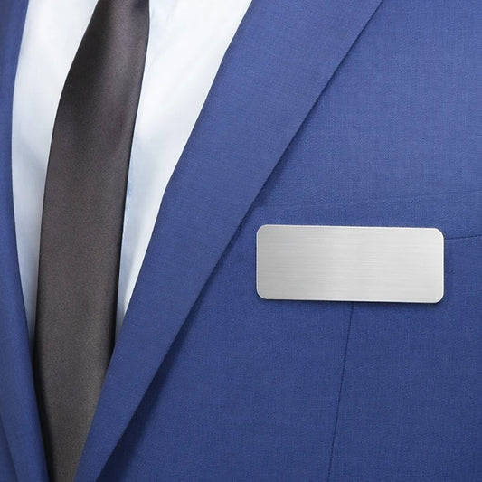 Silver metallic nametag with personalized engraved name and job title on the front