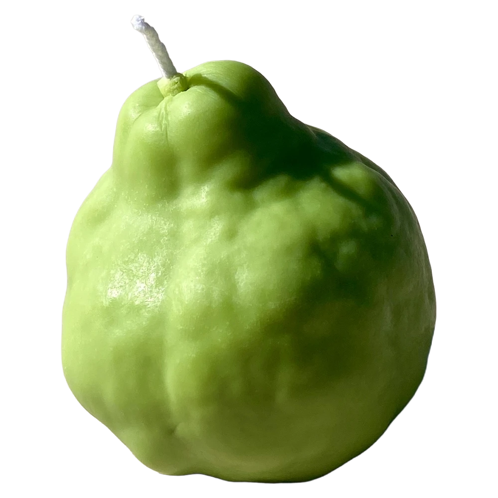 Realistic green pear shaped candle with a brown stem on a white surface