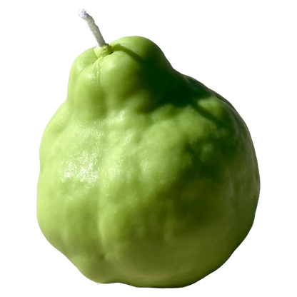 Realistic green pear shaped candle with a brown stem on a white surface